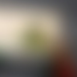 Hands hold a Samsung Z Tri-Fold tablet with anime wallpaper. Time reads 16:02. Dark background, vibrant colors, and tech ambiance.