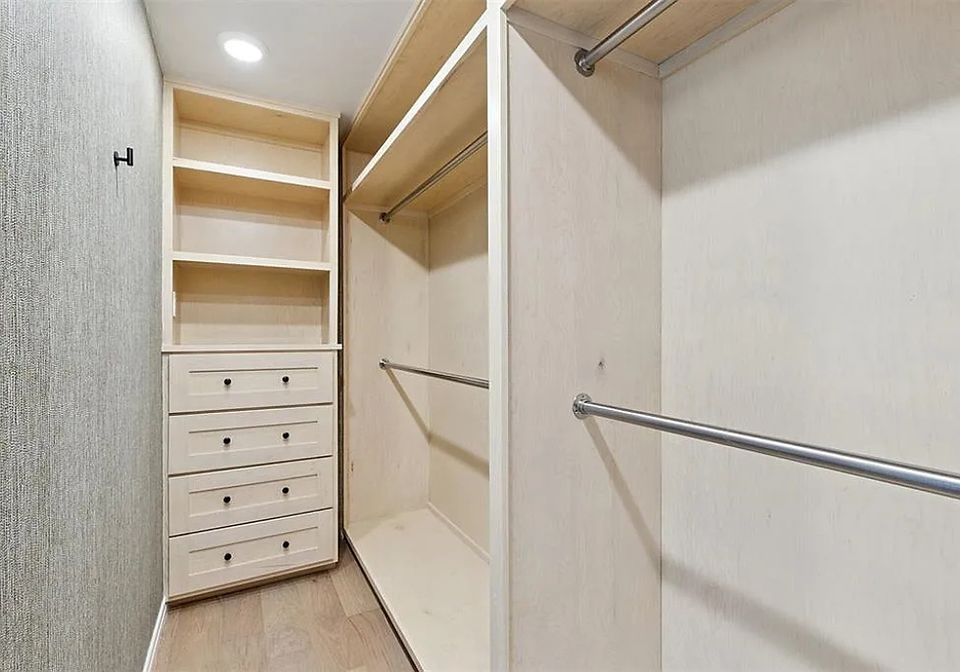 The master closet of a residential remodel by EBR Construction.