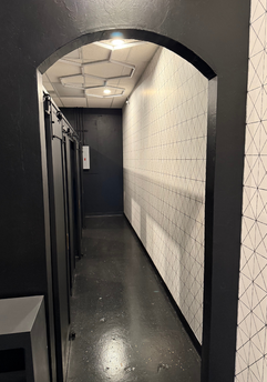 A view of the finished hallway area of the Red Light Method build-out by EBR Construction.