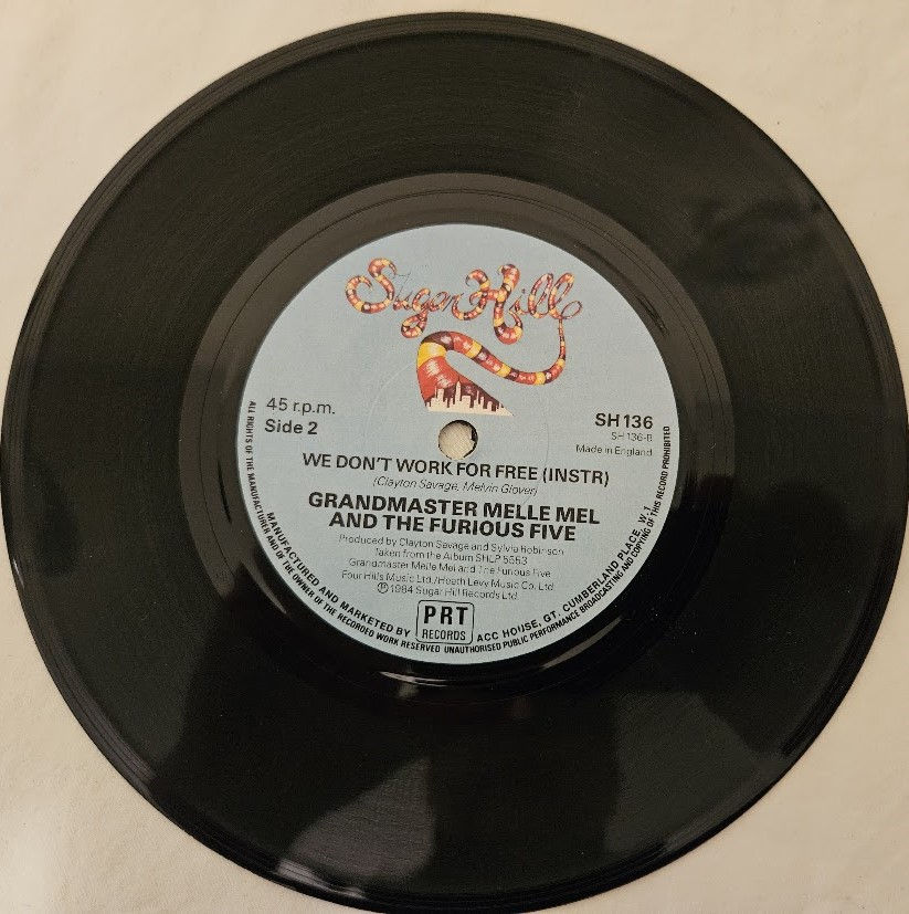 Thumbnail: Grandmaster Melle Mel & The Furious Five - We Don't Work For Free (7", Single) (