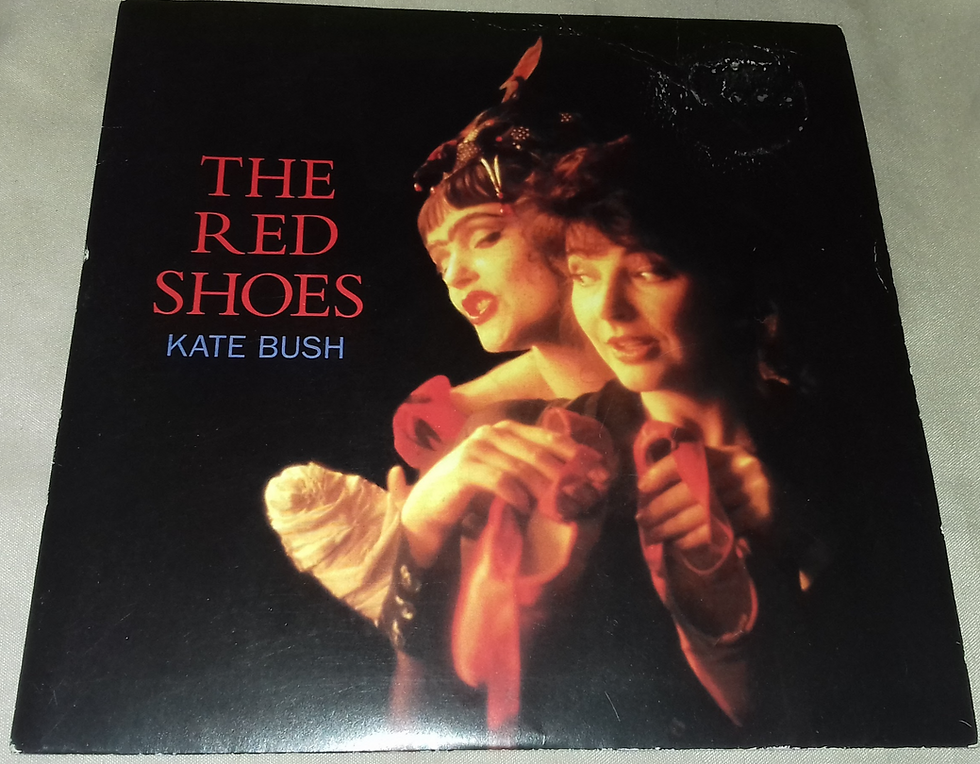 Kate Bush - The Red Shoes (7", Single, Pap) (EMI United Kingdom, EMI United King
