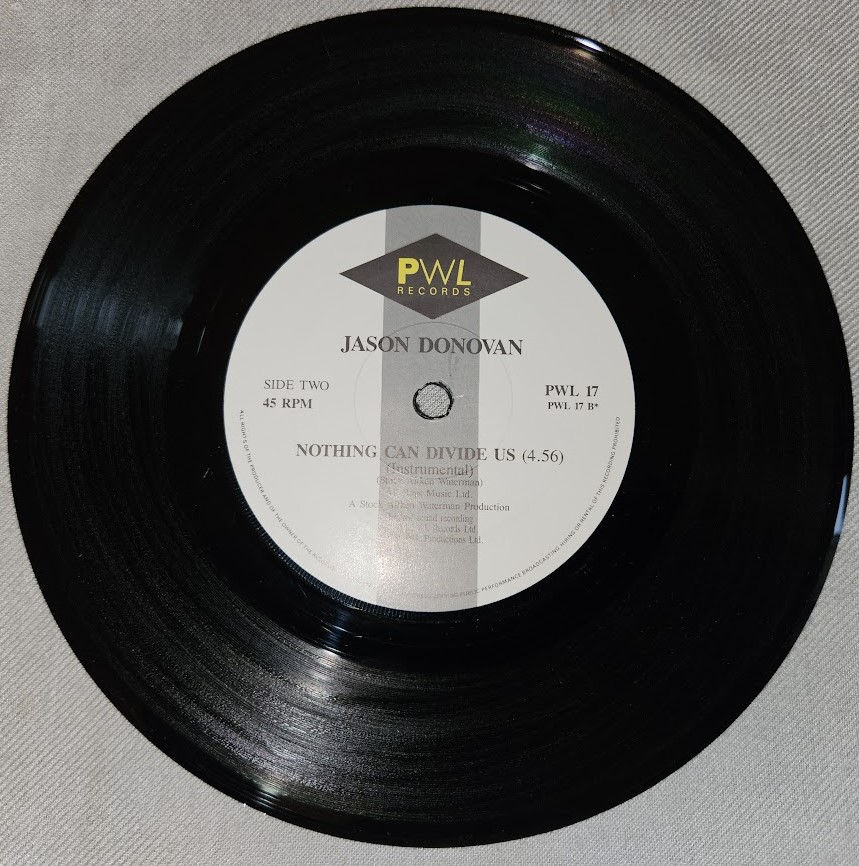 Miniaturbild: Jason Donovan - Nothing Can Divide Us (7", Single, Pos) (PWL Records)