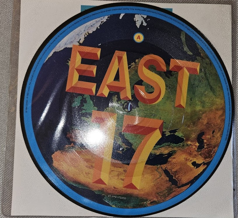 East 17 - Around The World (7", Single, Pic) (London Records, London Records)