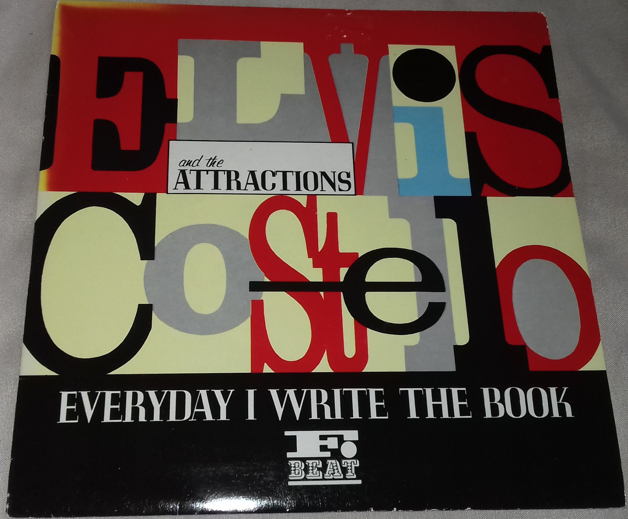 Elvis Costello And The Attractions* - Everyday I Write The Book (7", Single) (F