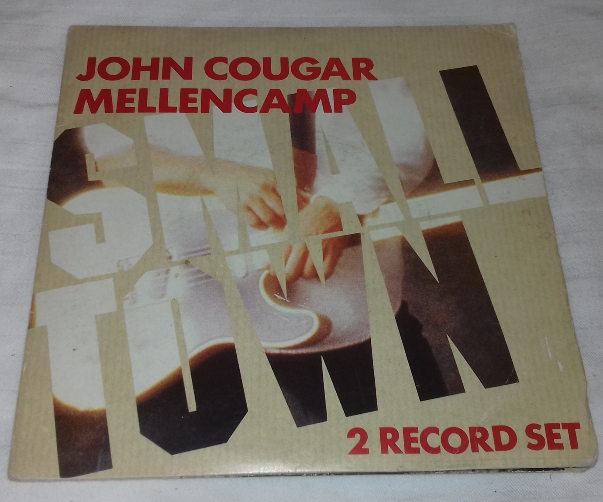 John Cougar Mellencamp - Small Town (2x7") (Riva (2), Phonogram)