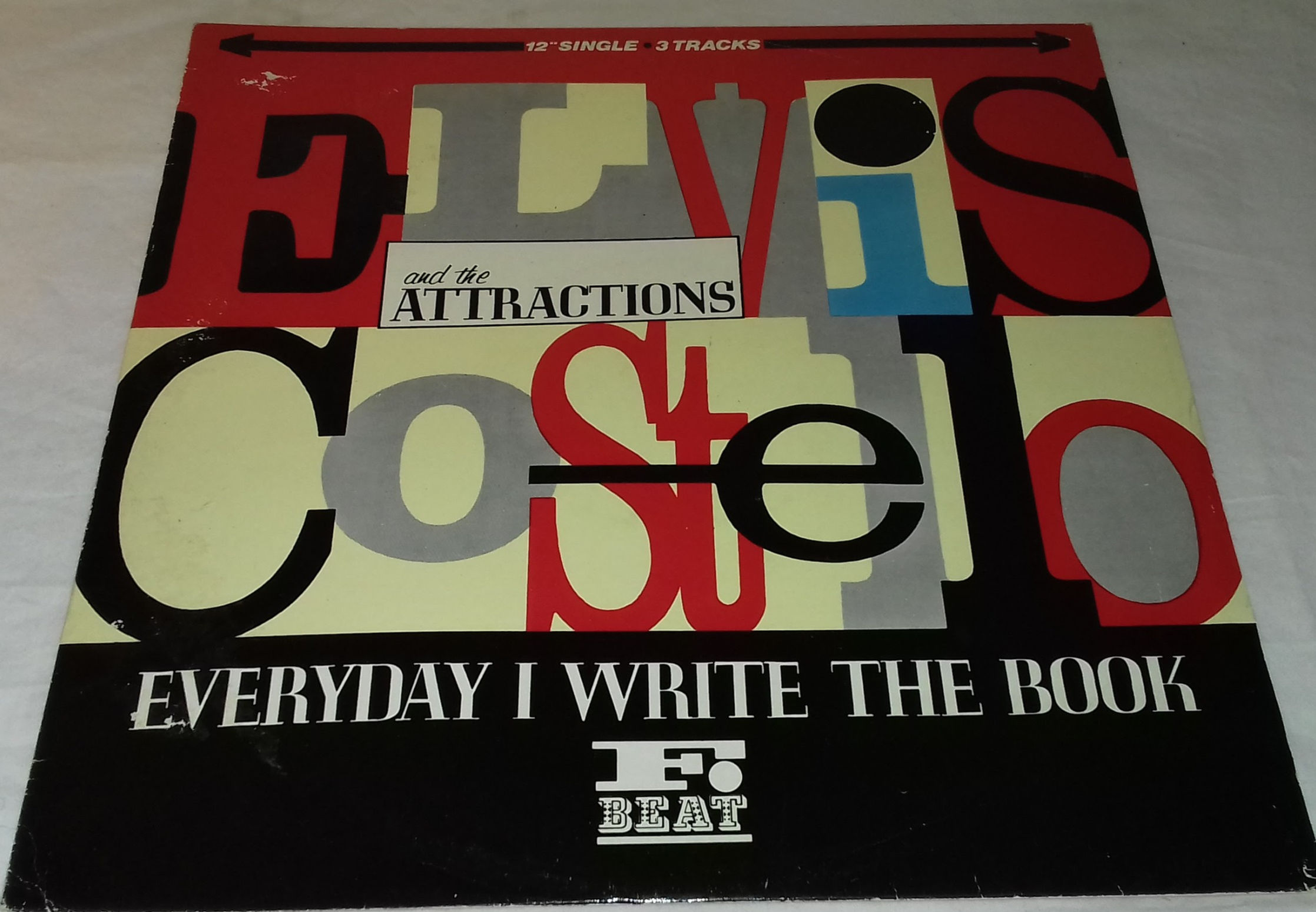 Elvis Costello And The Attractions* - Everyday I Write The Book (12", Single) (F