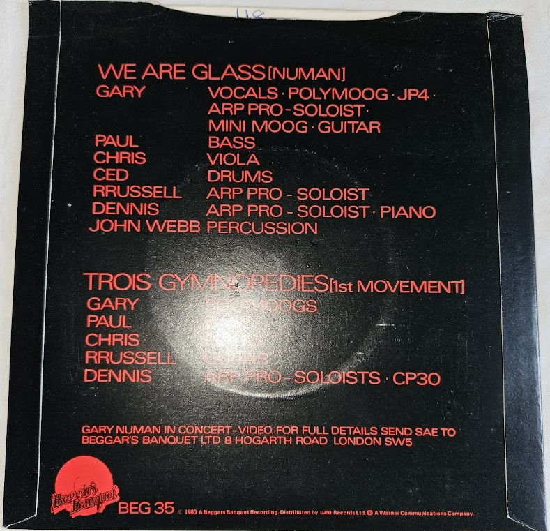 ภาพขนาดย่อ: Gary Numan - We Are Glass (7", Single) (Beggars Banquet, Beggars Banquet