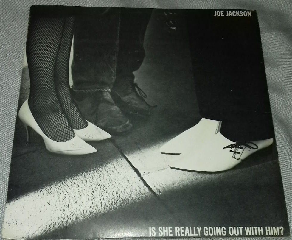 Joe Jackson - Is She Really Going Out With Him? (7", Single, RE) (A&M Records)