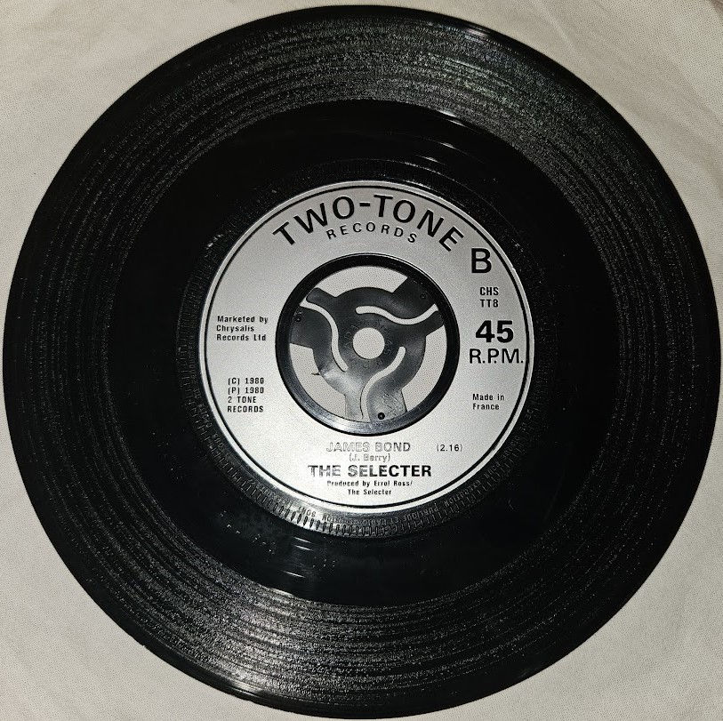Miniature : The Selecter - Three Minute Hero / James Bond (7", Single, Inj) (Two-Tone Record