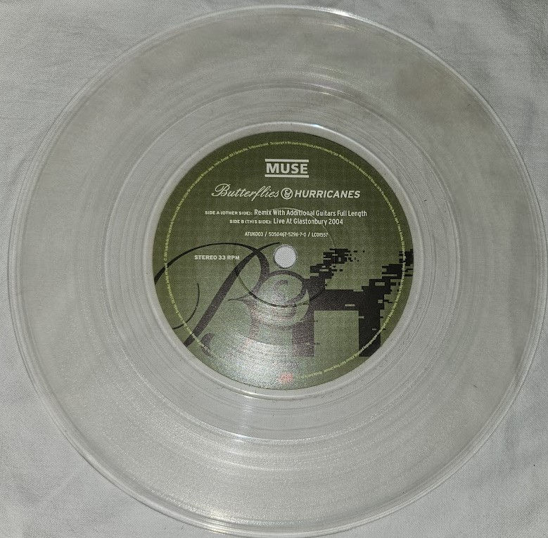Thumbnail: Muse - Butterflies & Hurricanes (7", Ltd, Cle) (Atlantic, Taste Media)