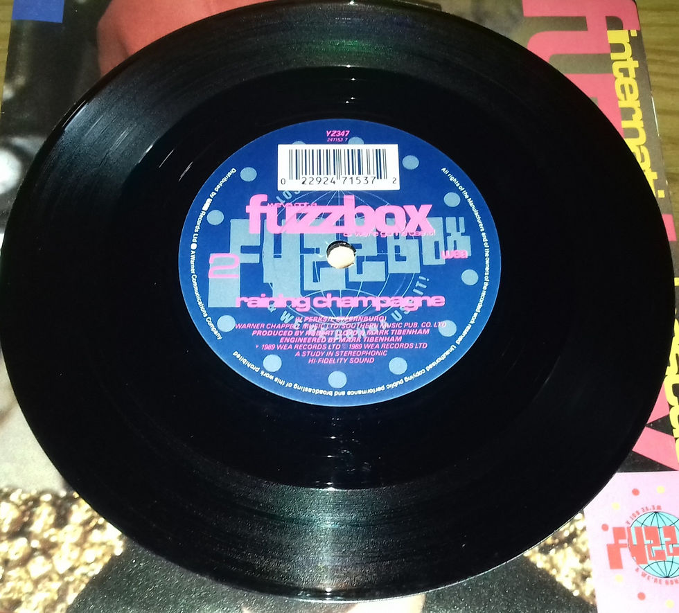 Miniatyrbild: Fuzzbox* - International Rescue (7", Single) (WEA, WEA, WEA, WEA)