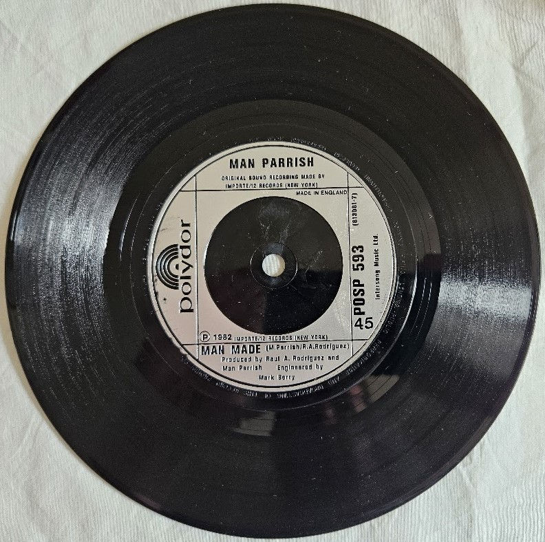 Miniaturbild: Man Parrish - Heatstroke (7", Single) (Polydor)