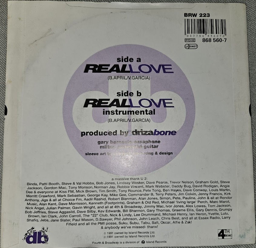 Miniaturbild: Driza Bone* - Real Love (7", Single, Sil) (4th & Broadway, Island Records)