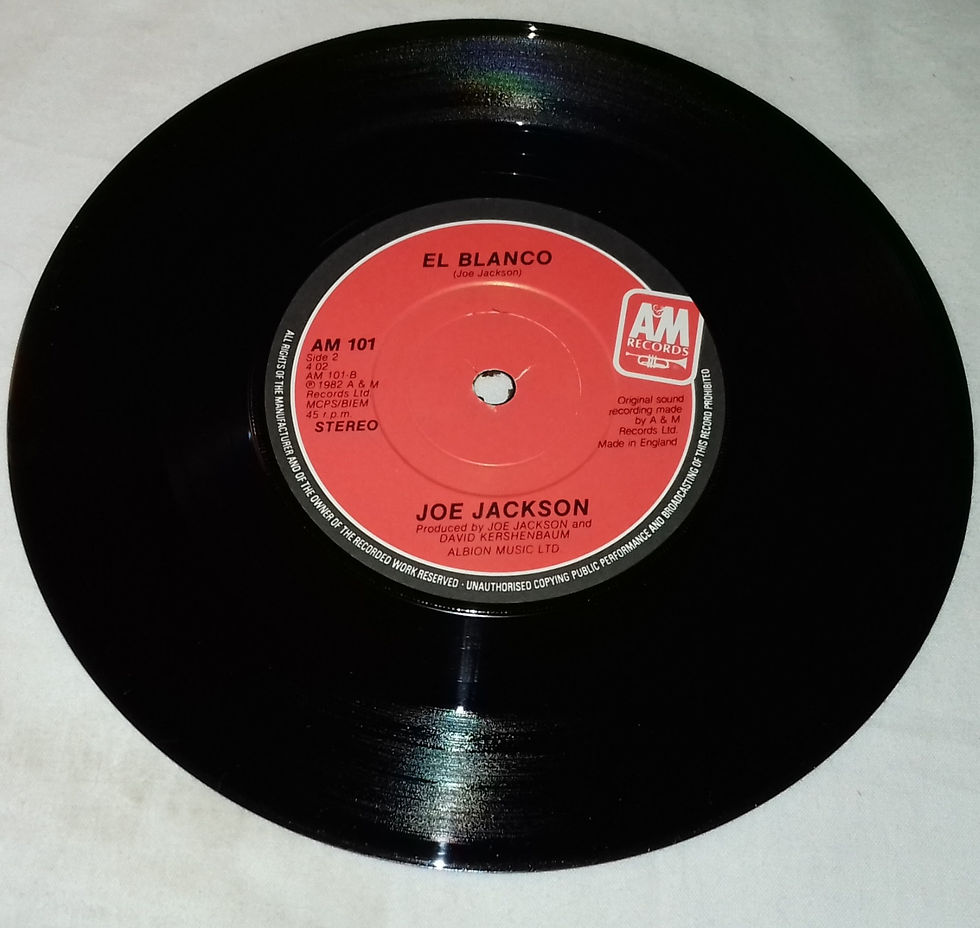 Miniature : Joe Jackson - Breaking Us In Two (7", Single, RE) (A&M Records)