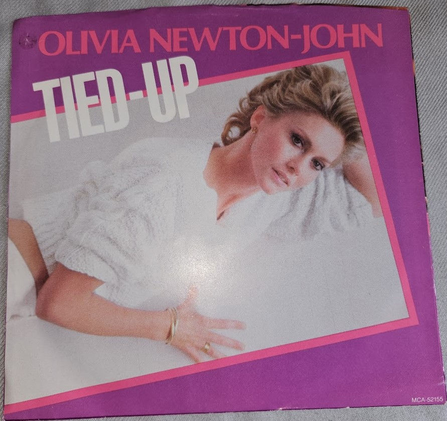 Olivia Newton-John - Tied-Up (7", Single, Promo) (MCA Records)