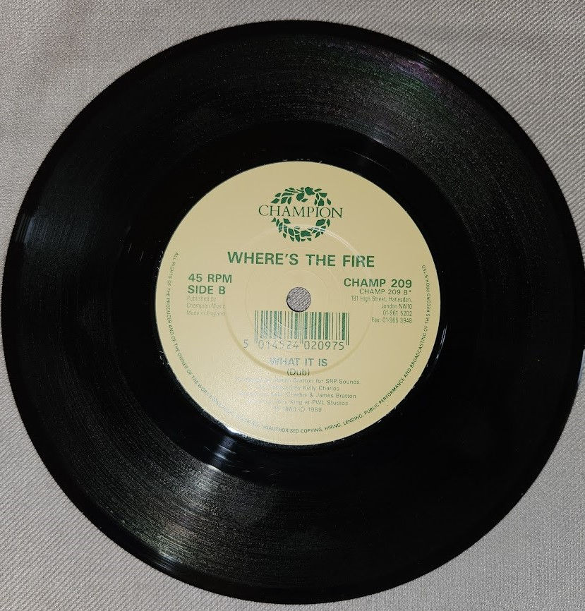 Miniaturbild: Where's The Fire - What It Is (7") (Champion)