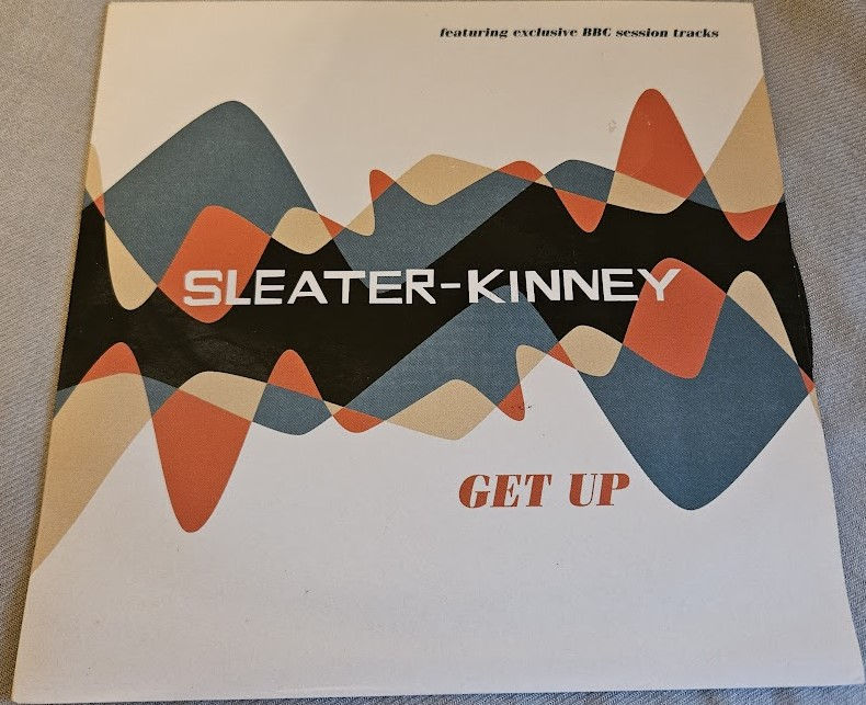 Sleater-Kinney - Get Up (7", Single) (Matador)