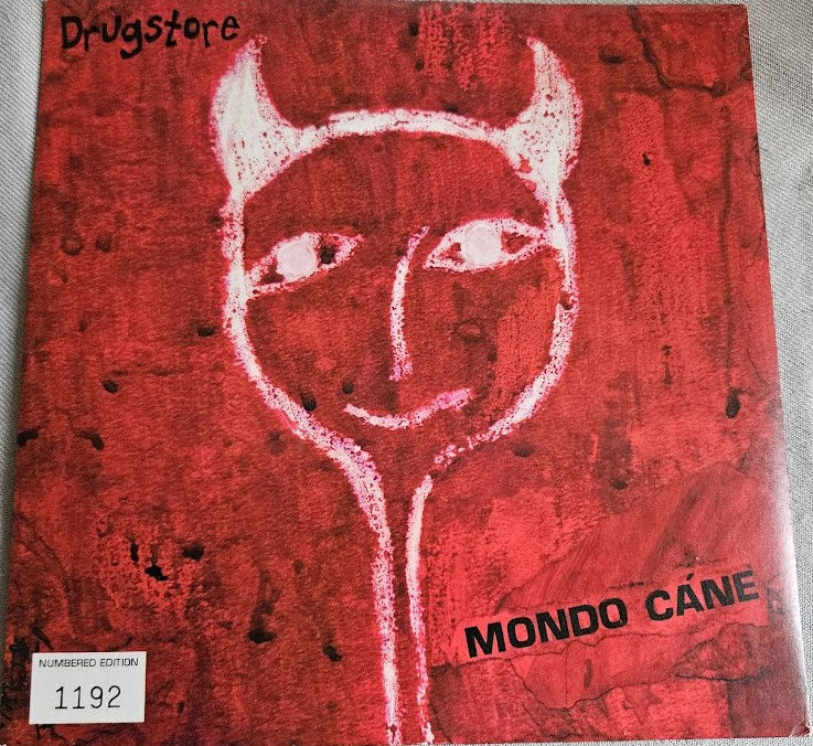 Drugstore - Mondo Cáne (7", Single, Num) (Honey Records, Honey Records)