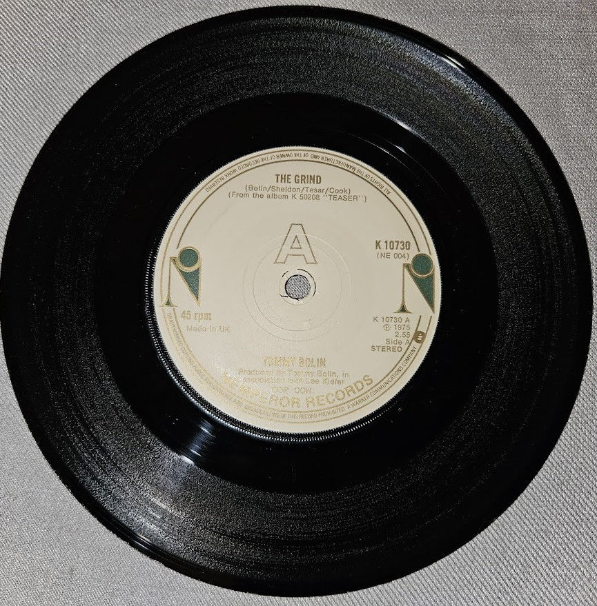 Tommy Bolin - The Grind (7", Single) (Nemperor Records)