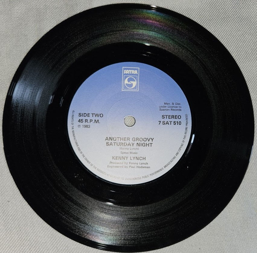 Miniatyrbild: Kenny Lynch - Half The Day's Gone And We Haven't Earne'd A Penny (7") (Satril)