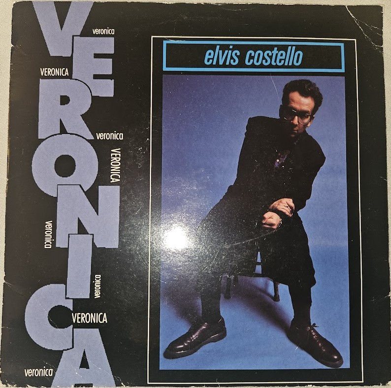 Elvis Costello - Veronica (7", Single) (Warner Bros. Records, Warner Bros. Recor