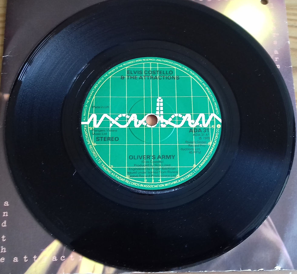 Miniaturbild: Elvis Costello And The Attractions* - Oliver's Army (7", Single, Sol) (Radar Rec