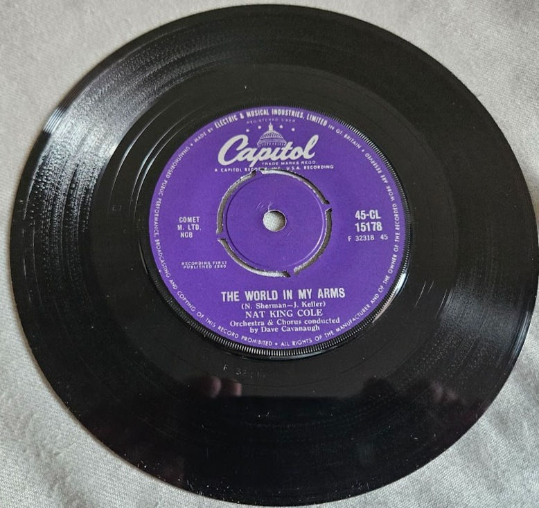 Thumbnail: Nat King Cole - The World In My Arms (7", Single) (Capitol Records)