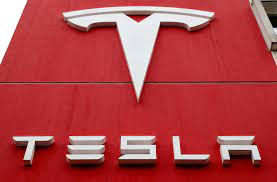 Tesla drives out of auto body 