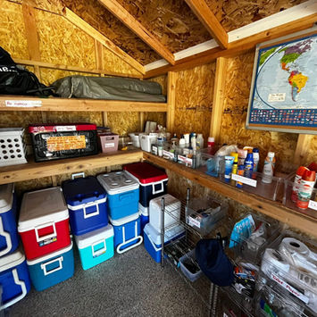 Inside the shack are coolers, sun screen, bug spray, and miscellaneos items