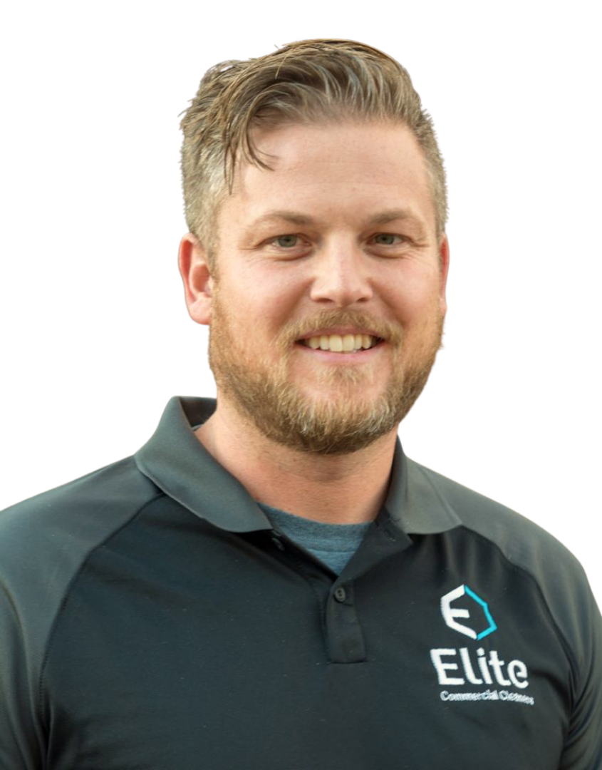 A male smiling in an Elite cleaning company shirt