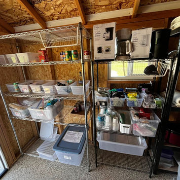 Inside the shack are coolers, sun screen, bug spray, and miscellaneous items