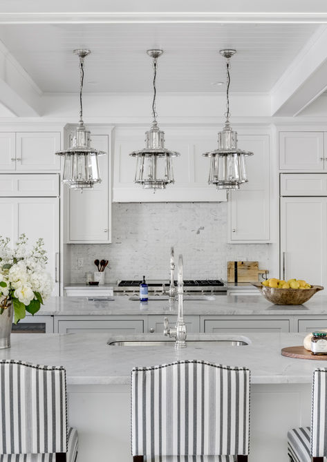 Light and airy kitchen and dining space with traditional interior decor and ceffered ceiling.
