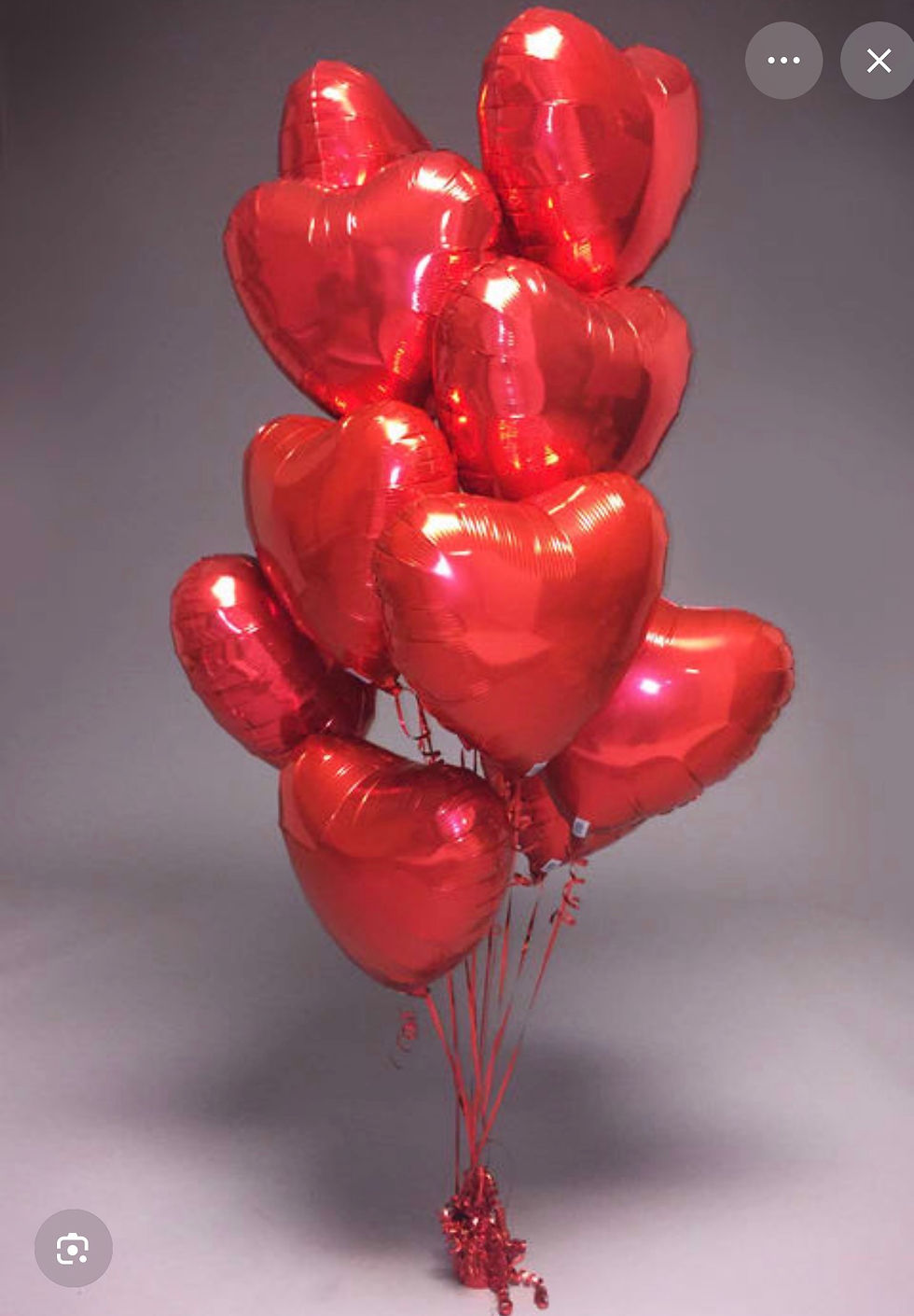 premium red heart helium balloons with matching ribbons, perfect for romantic celebrations and special occasions.