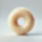 DALL·E 2025-03-17 06.38.31 - A realistic 3D render of a cream-colored donut-shaped hard ca