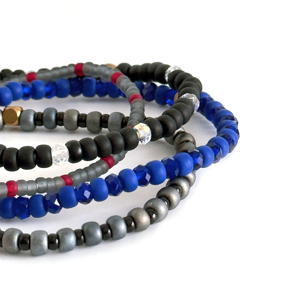 Thumbnail: Four deep blue beaded stretch bracelets stacked