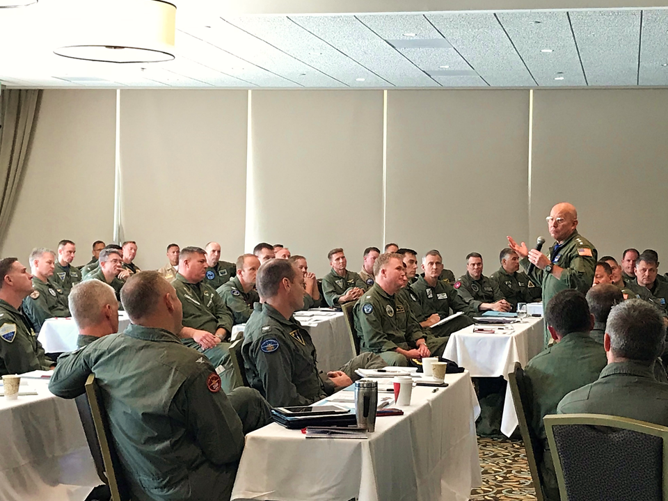 VADM Miller speaks at the O-6 training symposium.