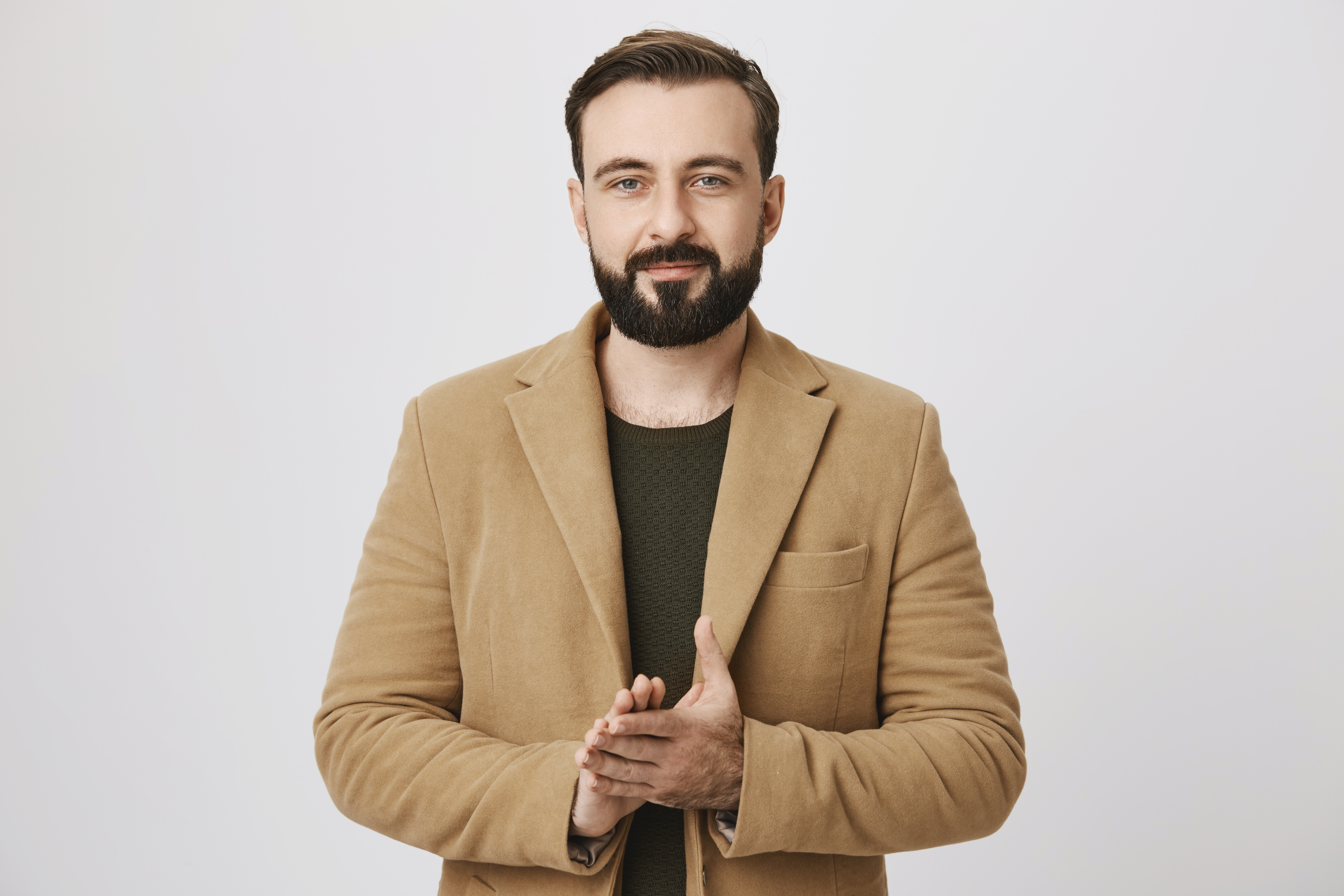 handsome-bearded-businessman-rubbing-hands-having-deal.jpg