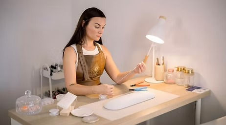 A display of BIAB nails, sculpted brows, and permanent jewellery in a luxe, modern beauty treatment setting.