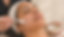 a person receiving a professional exfoliating facial treatment