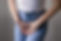 Female health concept. Woman hands holding crotch suffering from pain, burning, itching sy