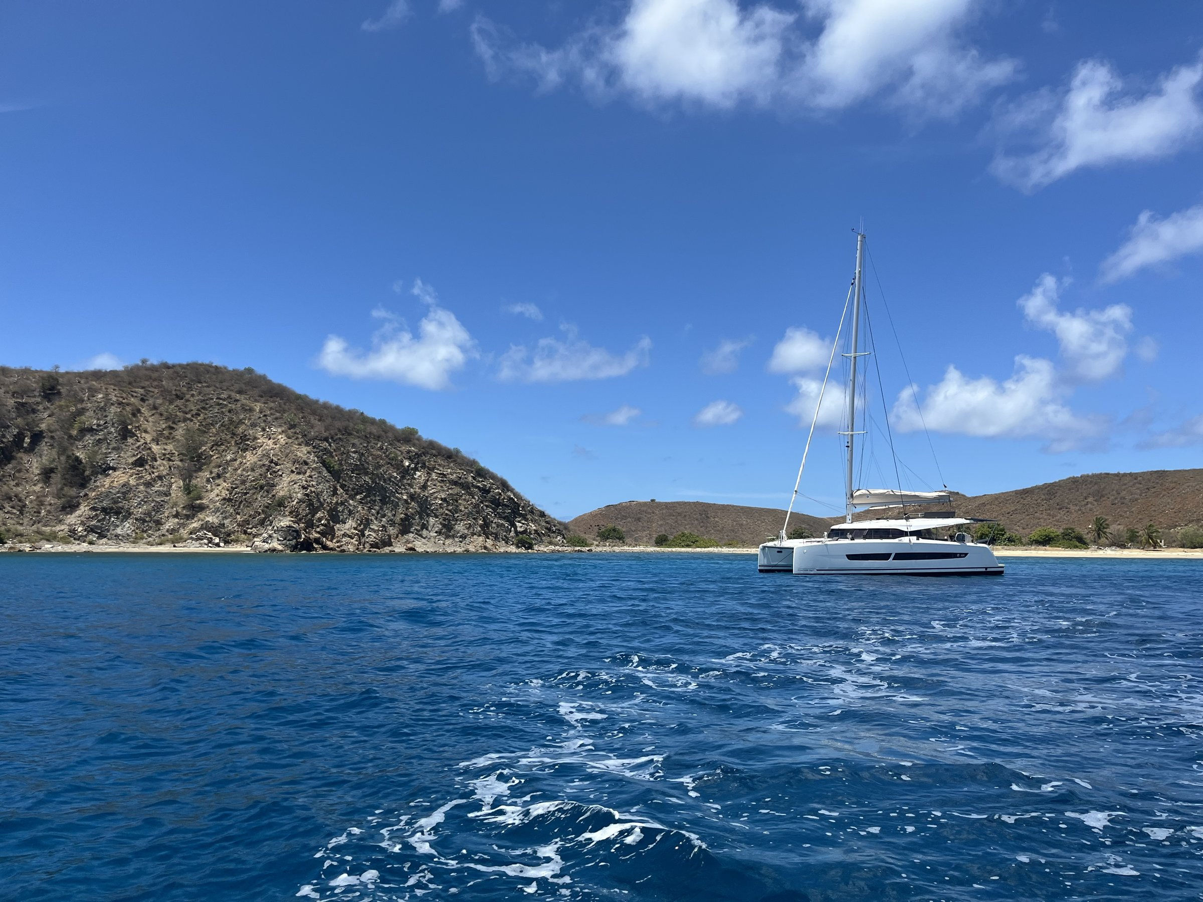 Private sailing catamaran anchored in a quiet BVI bay