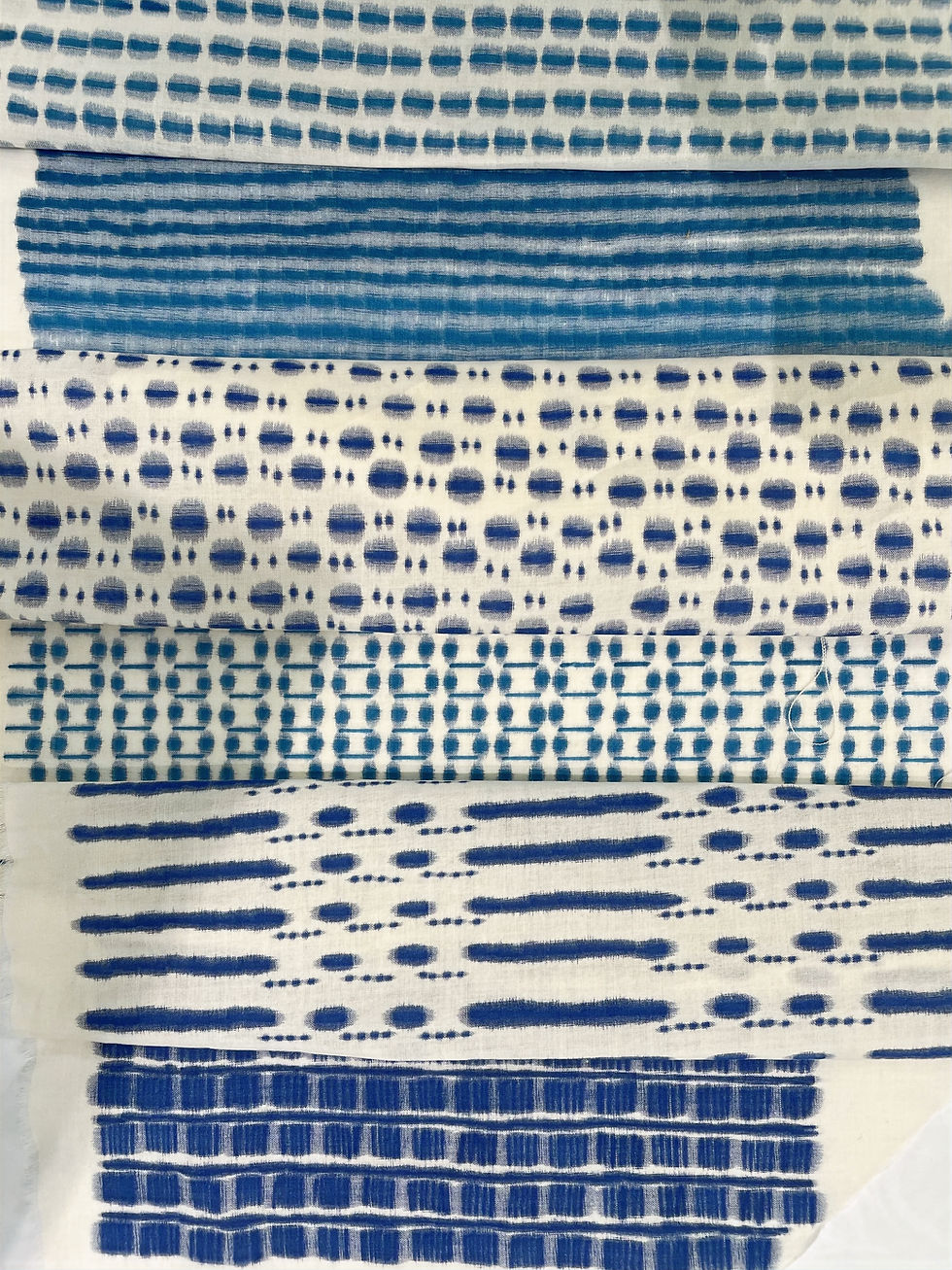 A selection of fabric with patterns inspired by Japanese geometric shapes on them.