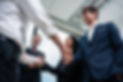 caucasian-businessman-making-a-handshake-together-2025-03-24-23-14-58-utc.jpg