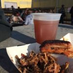 Eating ribs and brisket — Michigan style
