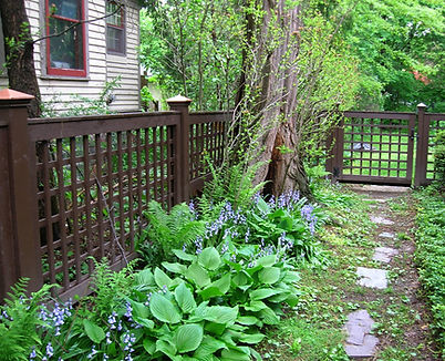 square lattice fence with copper federal post caps. Installed by The Elyria Fence company