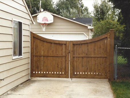 Good Neighbor cedar driveway gate built by Elyria Fence Inc