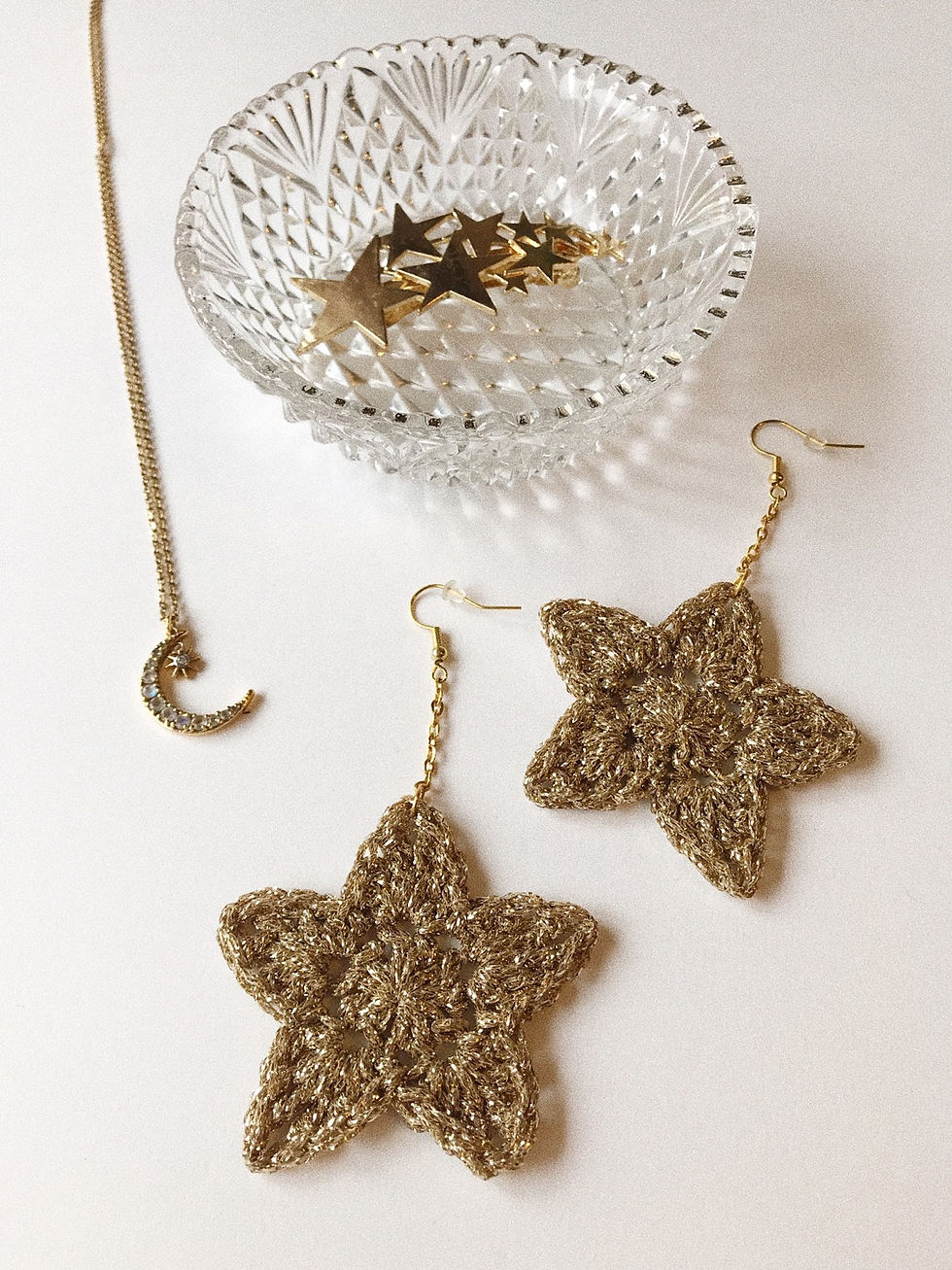 Thumbnail: Sparkly gold crocheted star earrings