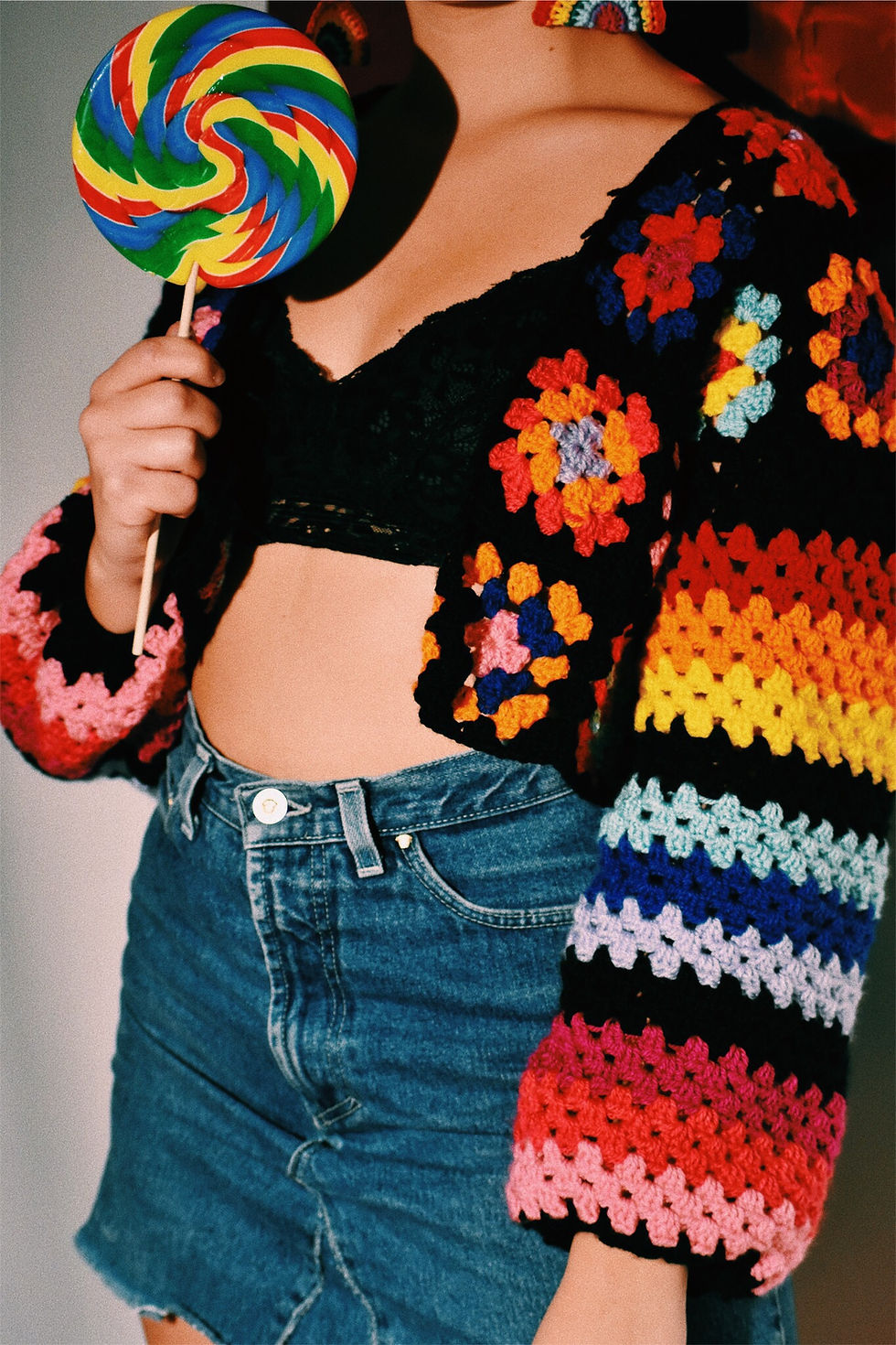 Thumbnail: Black crocheted granny squares and stripes cardigan