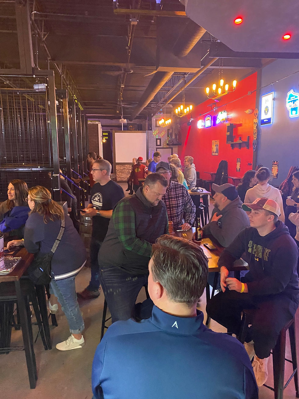 Customers celebrating opening of West Bend Axe and Escape