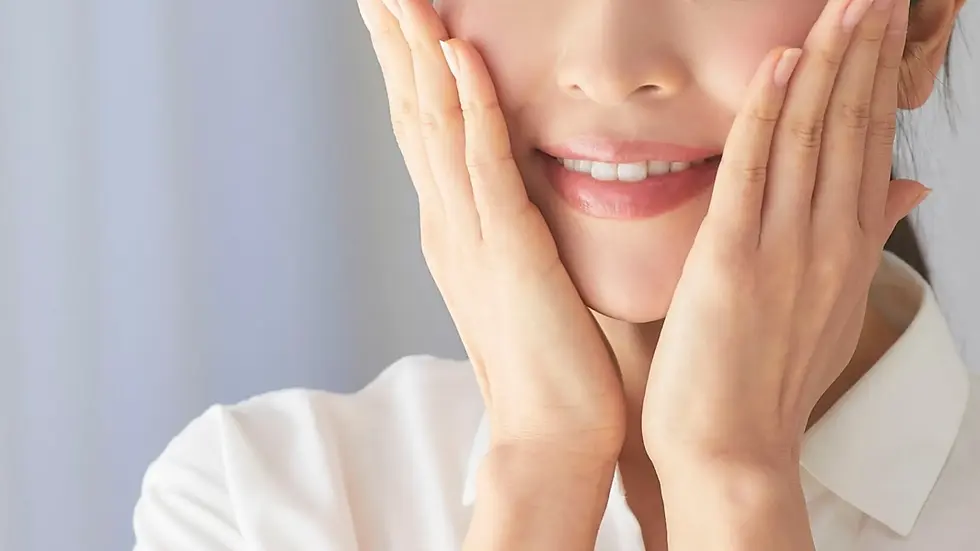 woman holding her face for face slimming